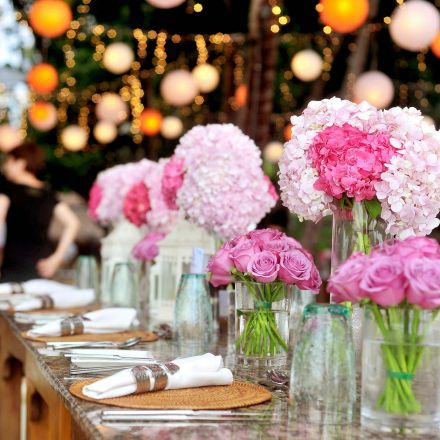 Table With Plates and Flowers Filed Neatly Selective Focus Photography